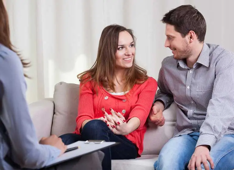 A man and woman talking to each other.