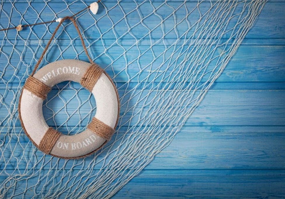 A life preserver hanging on the side of a net.